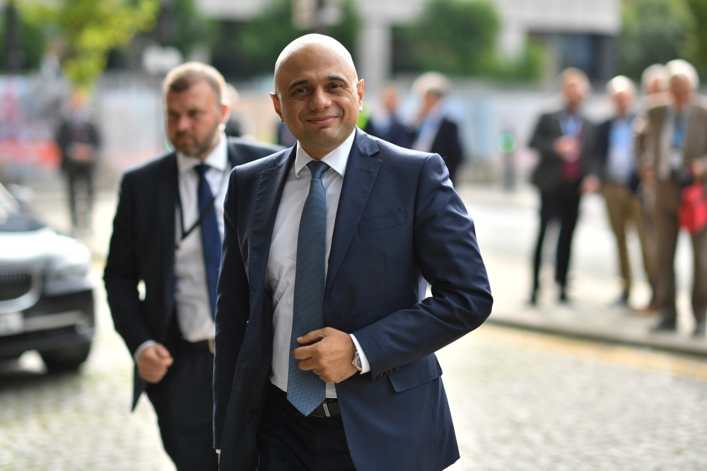 Britain's Chancellor of the Exchequer Sajid Javid arrives at The Midland hotel opposite the Manchester Central convention complex on the second day of the annual Conservative Party conference at the in Manchester, north-west England on September 30, 2019.