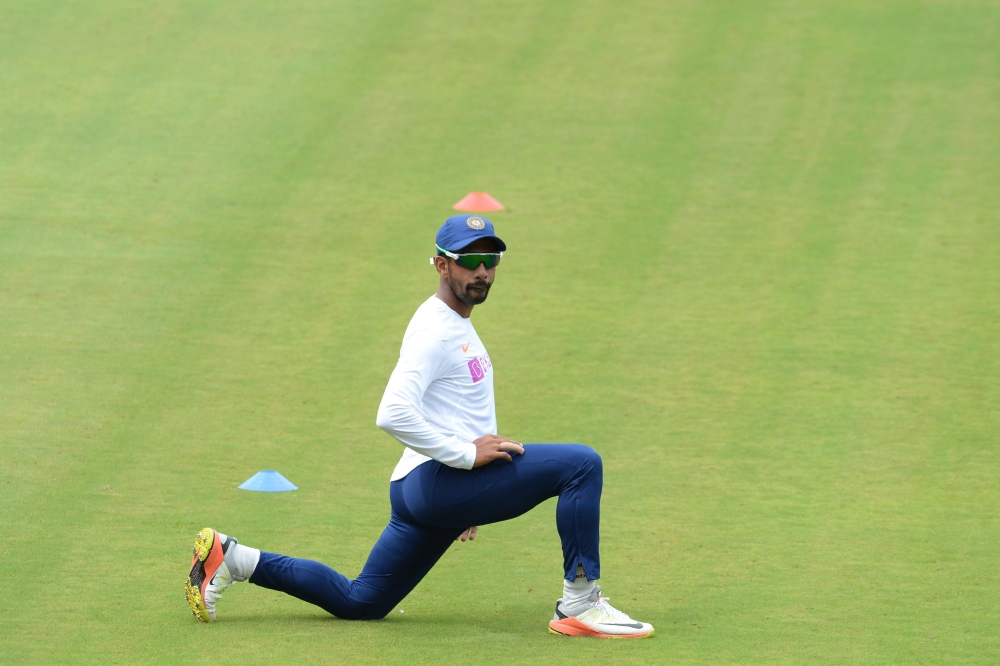 Indian cricketer Wriddhiman Saha stretches during a practice session ahead of the first test match between India and South Africa at the Dr. Y.S. Rajasekhara Reddy ACA-VDCA Cricket Stadium in Visakhapatnam on September 30, 2019. AFP / NOAH SEELAM 