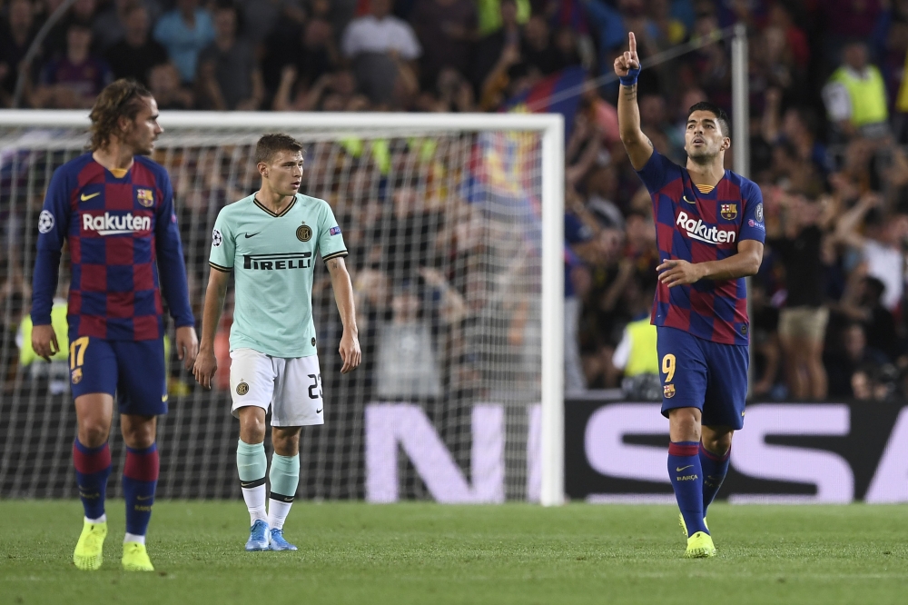 Barcelona's Uruguayan forward Luis Suarez celebrates his goal during the UEFA Champions League Group F football match between Barcelona and Inter Milan at the Camp Nou stadium in Barcelona, on October 2, 2019. / AFP / Josep Lago 