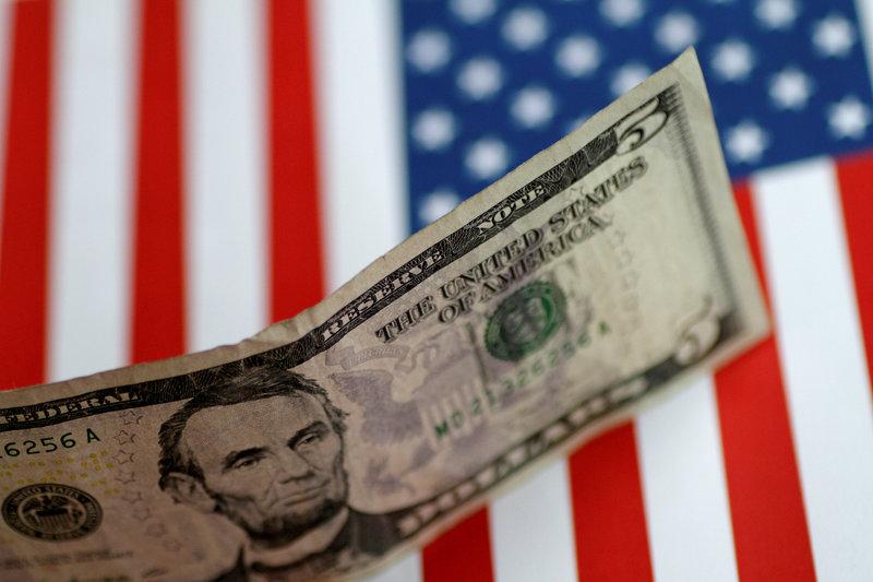 FILE PHOTO: A US five dollar note is seen in this illustration photo, June 1, 2017. Reuters / Thomas White