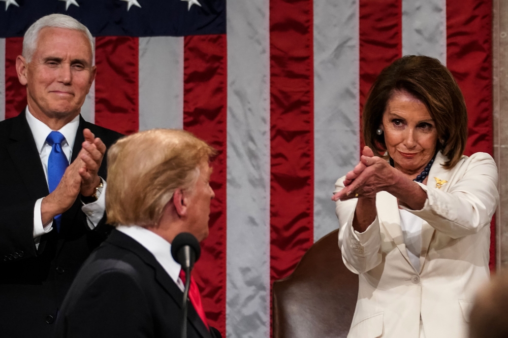 FILE PHOTO: Donald Trump arrives to deliver the State of the Union address alongside Speaker of the House Nancy Pelosi and Vice President Mike Pence at the US Capitol on February 5, 2019. AFP / Doug Mills