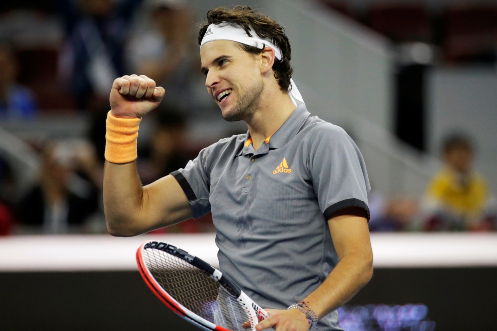 Dominic Thiem of Austria celebrates winning the match against Karen Khachanov of Russia. REUTERS/Jason Lee