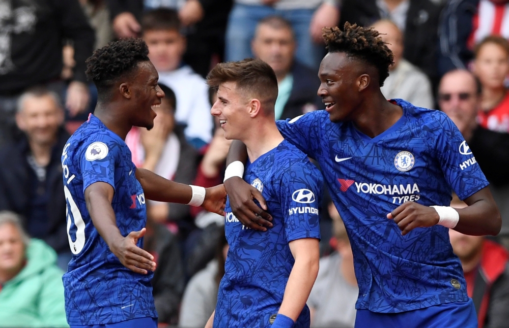 Chelsea's Mason Mount celebrates scoring their second goal with Callum Hudson-Odoi and Tammy Abraham. Reuters/Tony O'Brien