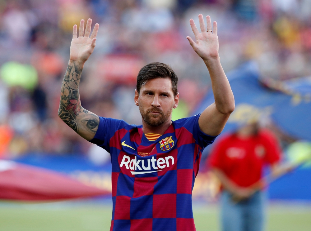 FILE PHOTO: Barcelona's Lionel Messi waves to fans before the match REUTERS/Albert Gea/File Photo