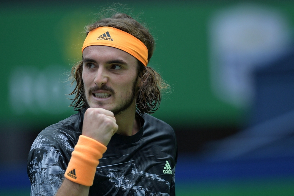 Stefanos Tsitsipas of Greece reacts while playing against Felix Auger-Aliassime of Canada during their second round men's singles match at the Shanghai Masters tennis tournament in Shanghai on October 9, 2019. / AFP / NOEL CELIS