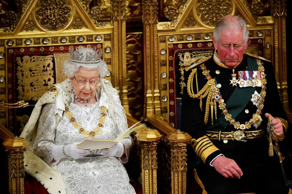 Britain's Queen Elizabeth delivers the Queen's Speech during the State Opening of Parliament, next to Charles, Prince of Wales, in London, Britain October 14, 2019. (REUTERS/Toby Melville/Pool)