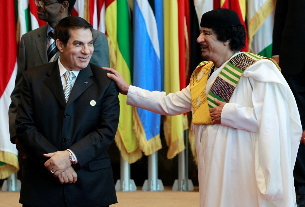 FILE PHOTO: Zine el-Abidine Ben Ali of Tunisia meets Muammar Gaddafi of Libya as they pose for a family photo during the third European Union-Africa summit in Tripoli November 29, 2010. Reuters / Francois Lenoir