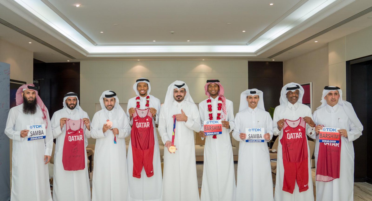 The Qatar Olympic Committee (QOC) President H E Sheikh Joaan bin Hamad Al Thani meets with Mutaz Essa Barshim and Abderrehman Samba in Doha, yesterday. Barshim won the high jump gold while Samba bagged the bronze in the 400m hurdles during the 2019 IAAF W