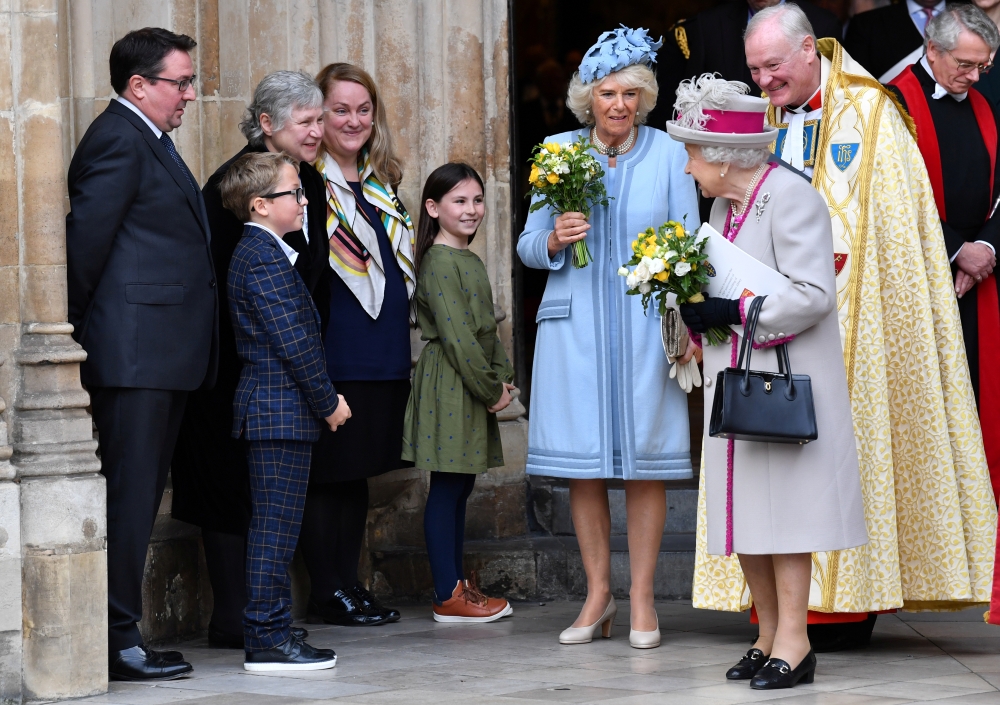 Britain's Queen Elizabeth and Camilla, Duchess of Cornwall, leave after a service to mark the 750th anniversary of Westminster Abbey in London, Britain October 15, 2019. Paul Ellis/Pool via Reuters 
 