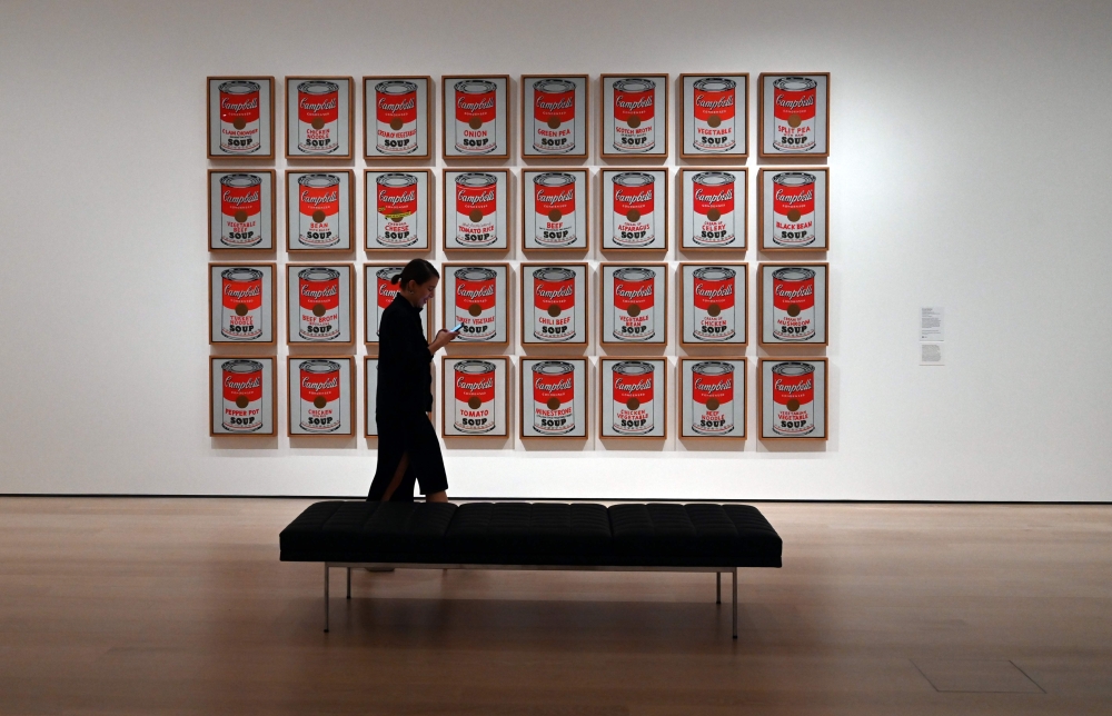 A woman walks past Andy Warhol 