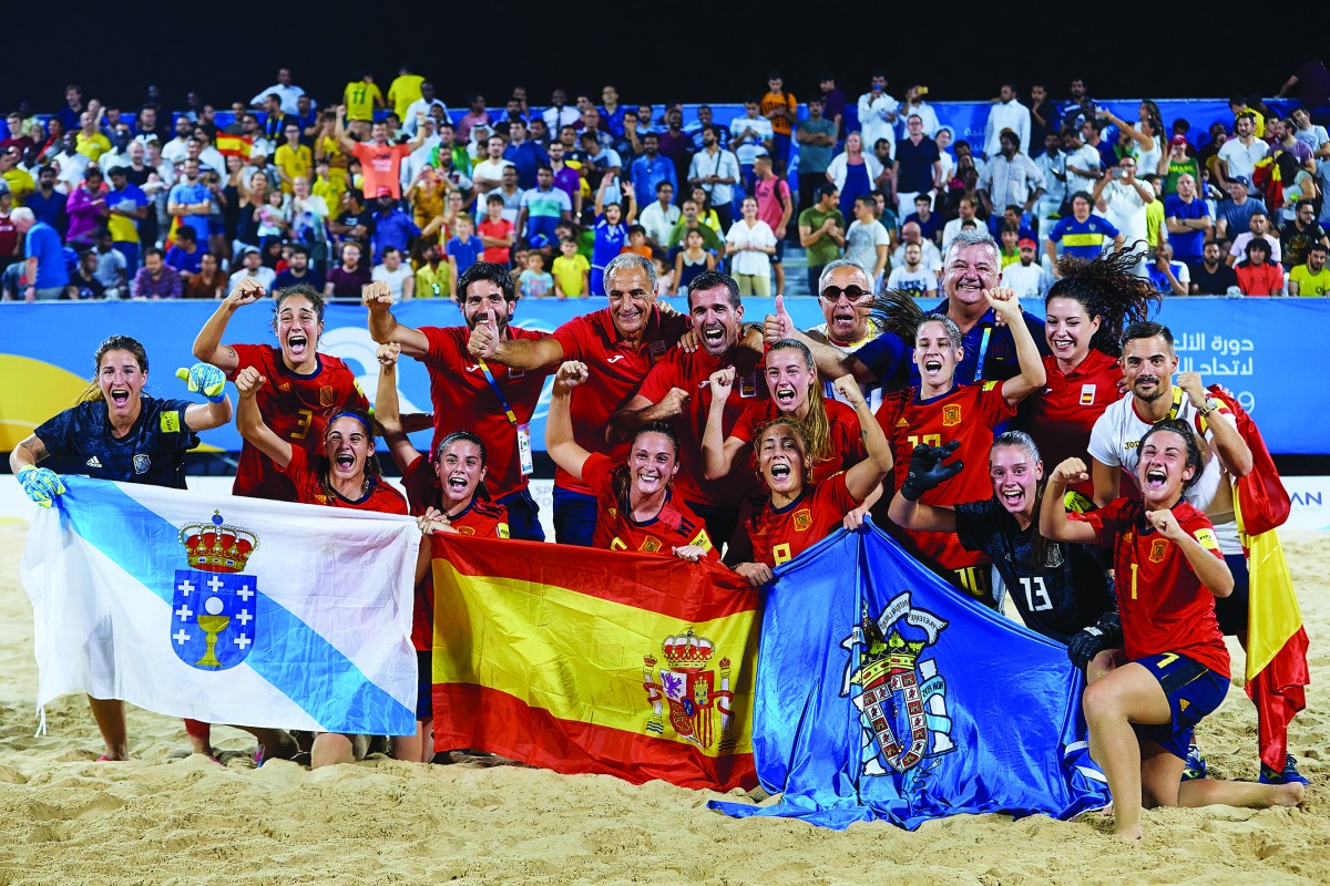 Spain’s beach soccer team’s players celebrate after winning gold medal yesterday.  (Laurel Photo Services) 