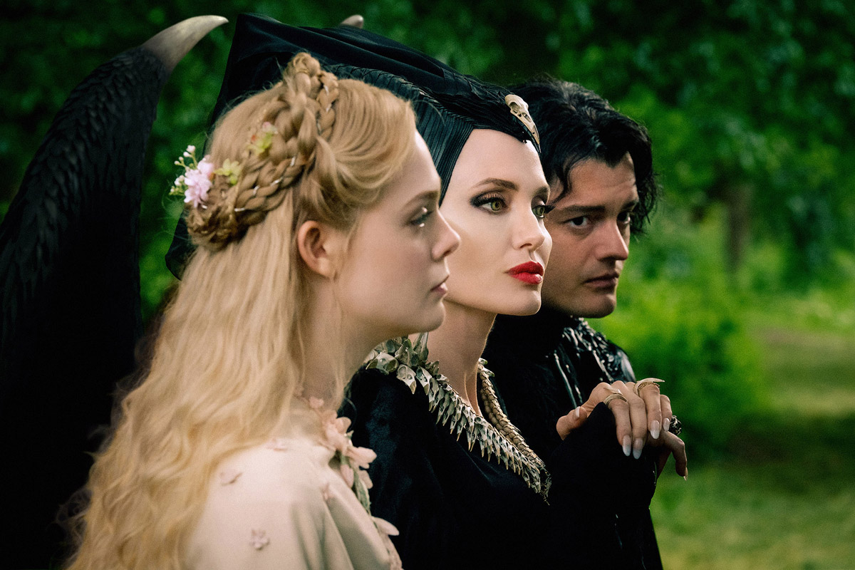 (L-r) Elle Fanning, Angelina Jolie and Sam Riley in 