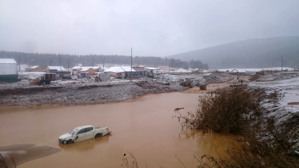 This handout picture released by the Russian Emergency Situations Ministry on October 19, 2019, shows a flooding after a dam failure in a gold miners village close to the town of Shchetinkino, about 250 km from the city of Krasnoyarsk. AFP PHOTO / RUSSIAN