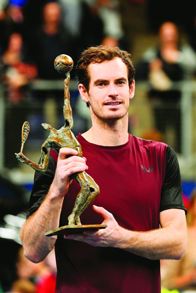 Britain's Andy murray celebrates with the trophy after winning against Switzerland's Stanislas Wawrinka in their men's single tennis final match of the European Open ATP Antwerp, on October 20, 2019 in Antwerp. AFP / BELGA / John Thys