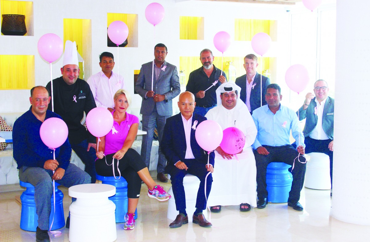 Sealine Beach Resort officials pose for a group photo.