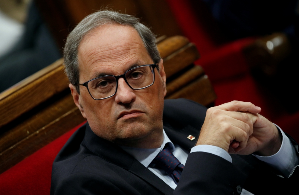 Catalan leader Quim Torra sits in the Parliament of Catalonia after Spain's Supreme Court jailed nine separatist leaders, triggering violent protests in the region, in Barcelona, Spain, October 17, 2019. Reuters/Albert Gea