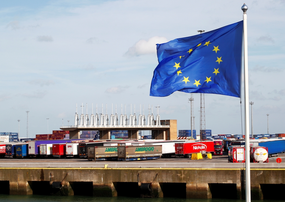 An EU flag flutters at the port of Zeebrugge after British police found bodies inside a lorry container in Grays, Essex, in Zeebrugge, Belgium October 24, 2019. Reuters/Francois Lenoir
