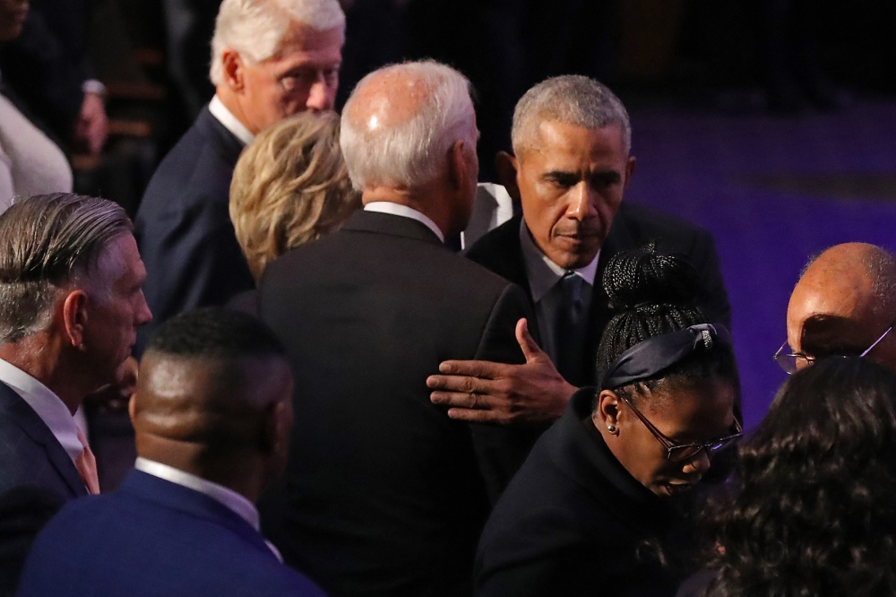 Barack Obama (R) embraces Joe Biden at the conclusion of the funeral service for Rep. Elijah Cummings (D-MD) at New Psalmist Baptist Church on October 25, 2019 in Baltimore, Maryland.  Chip Somodevilla/Getty Images/AFP 