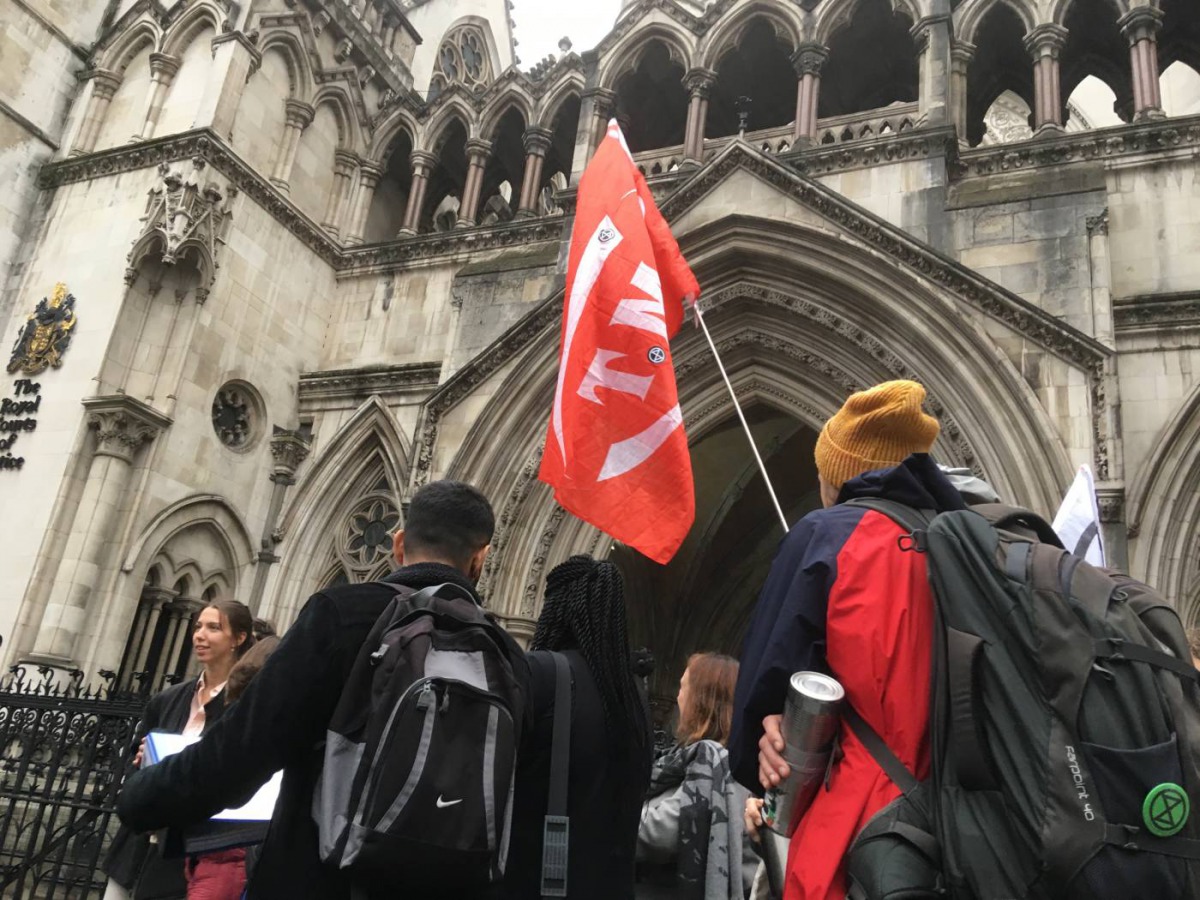 Extinction Rebellion climate change activists gather outside the Royal Courts of Justice in London before a judicial review hearing on a protest ban issued during a series of protests in October, Oct. 24, 2019. Thomson Reuters Foundation/Laurie Goering