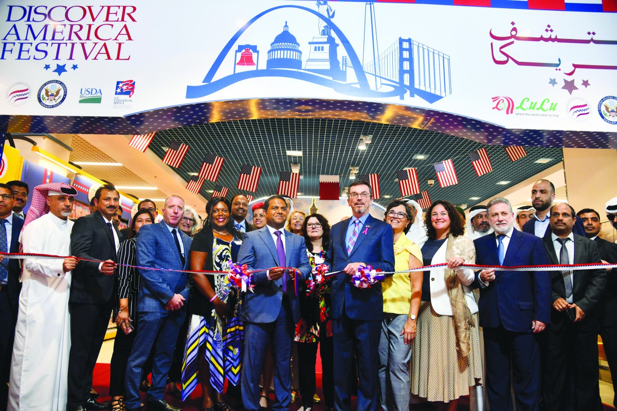 Mohamed Althaf, Regional Director of Lulu Group, and US Chargé d’Affaires, William Grant, with other officials during the opening of the Discover America Festival held at Lulu Hypermarket, Al Messila Branch, yesterday. Pic: Baher Amin / The Peninsula