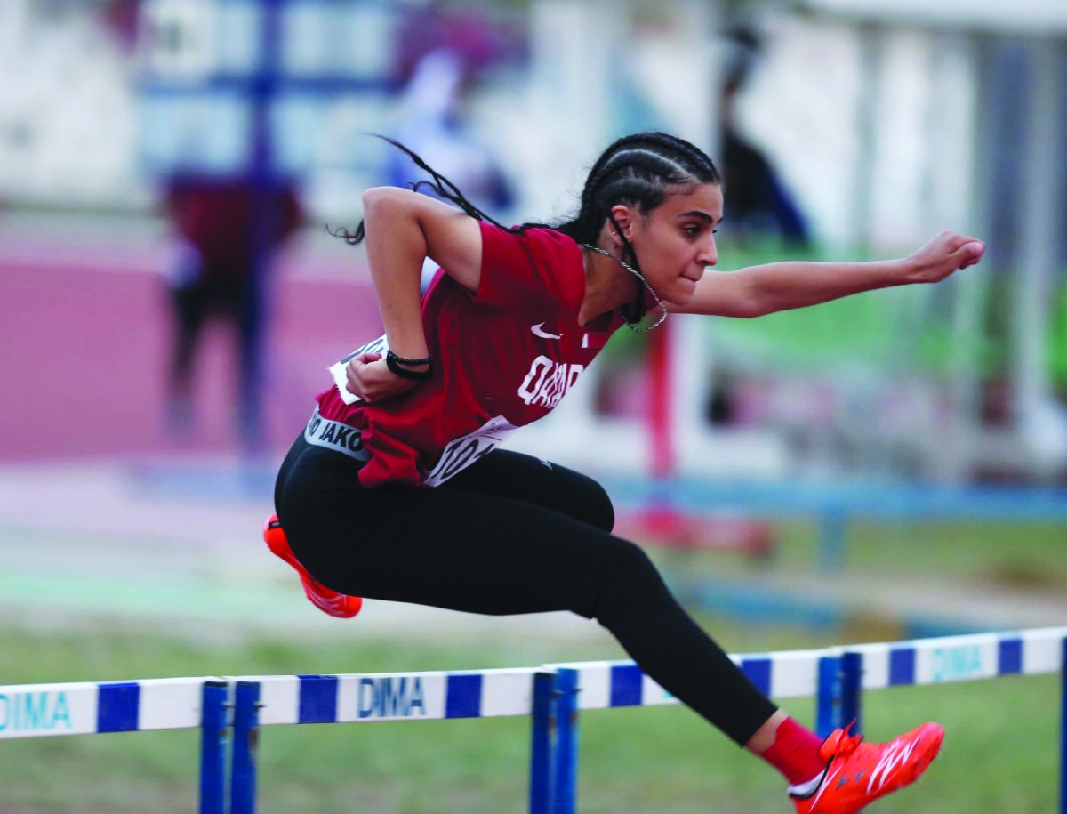 Qatar’s Ala Riad competing in the 100 metres hurdles final during the 6th GCC Women’s Games in Kuwait City, yesterday. Farid won the silver medal.