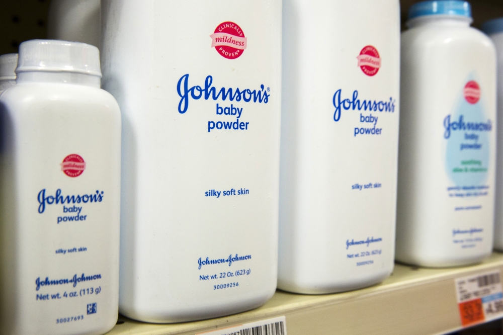 Bottles of Johnson & Johnson baby powder line a drugstore shelf in New York October 15, 2015. Reuters/Lucas Jackson
