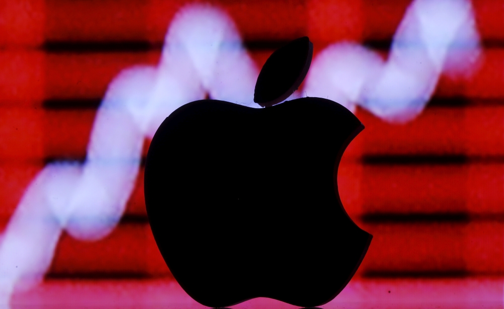 FILE PHOTO: A 3D printed apple logo is seen in front of a displayed stock graph in this illustration taken February 26, 2016. REUTERS