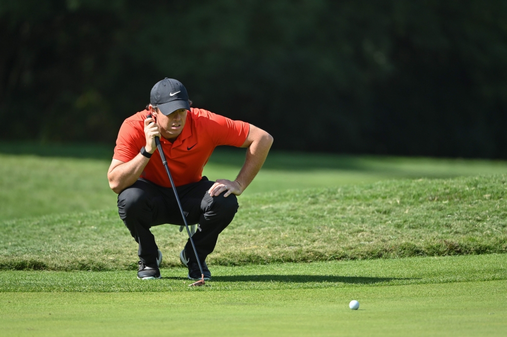 Rory McIlroy of Northern Ireland lines up a putt during the second round of the WGC-HSBC Champions golf tournament in Shanghai on November 1, 2019. AFP / HECTOR RETAMAL