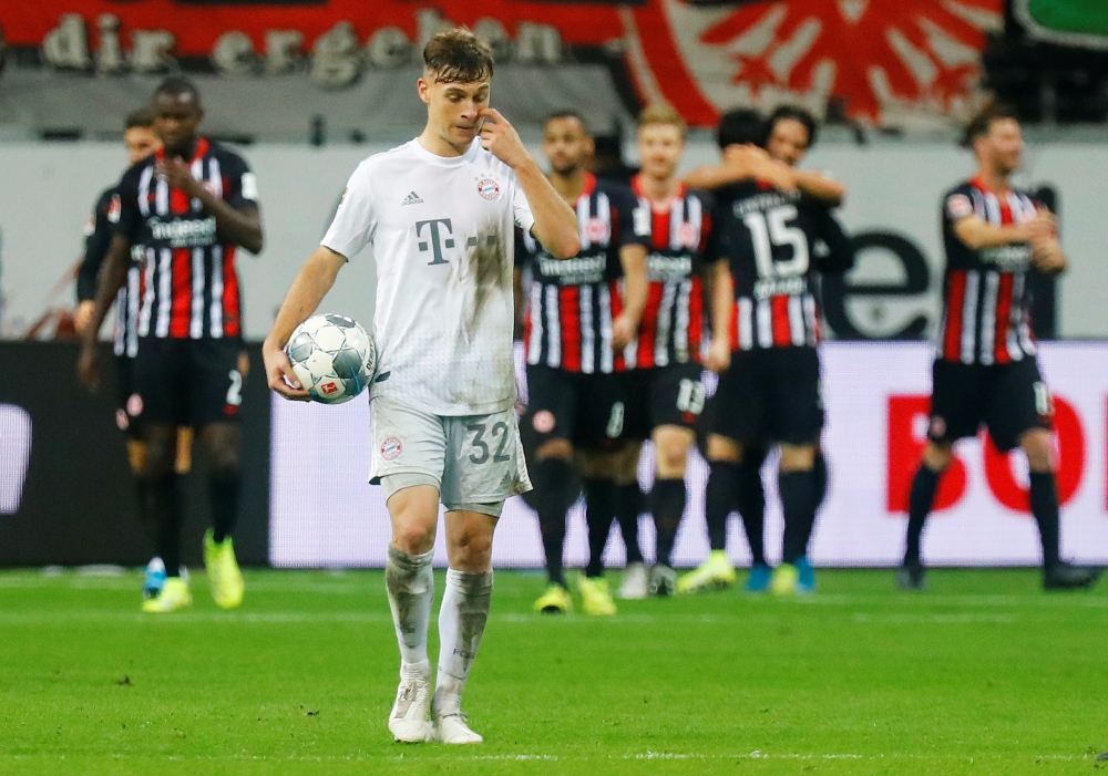Bayern Munich's Joshua Kimmich looks dejected after Eintracht Frankfurt's Goncalo Paciencia scores their fifth goal REUTERS/Ralph Orlowski 