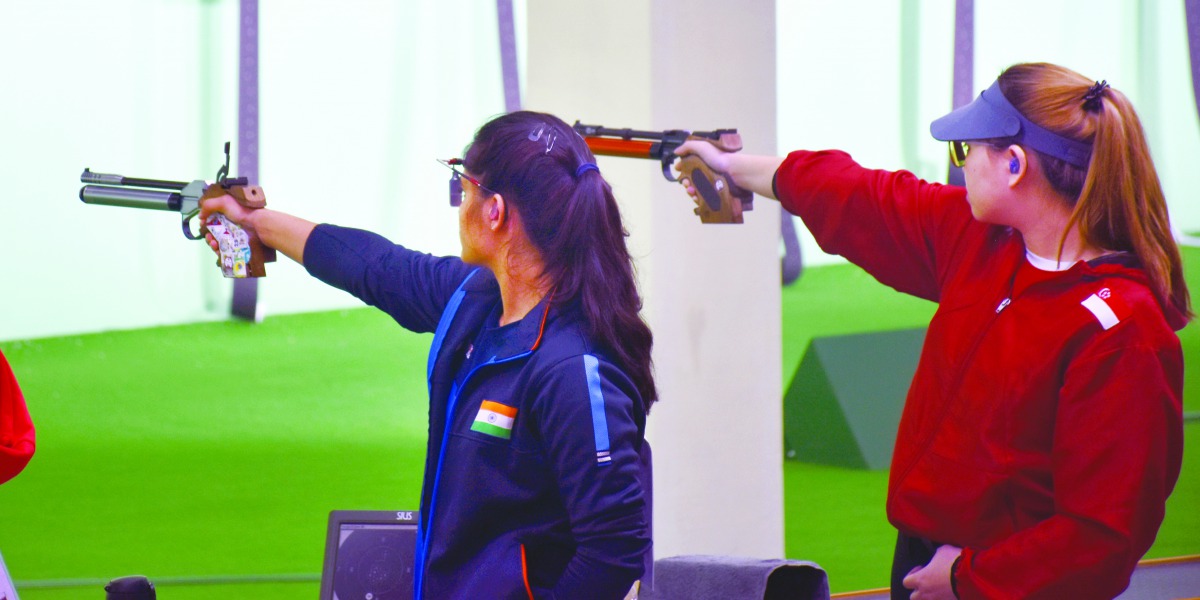 India’s Manu Bhaker (left) and Xiu Hong Teh of Singapore during the women’s 10m air pistol event at Losail shooting Range yesterday. Pic: Chinthana Wasala/The Peninsula