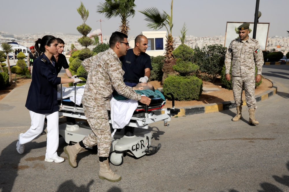 A tourist, who was injured in a stabbing, is rushed into King Hussein Medical Center in Amman, Jordan November 6, 2019. REUTERS/Muhammad Hamed