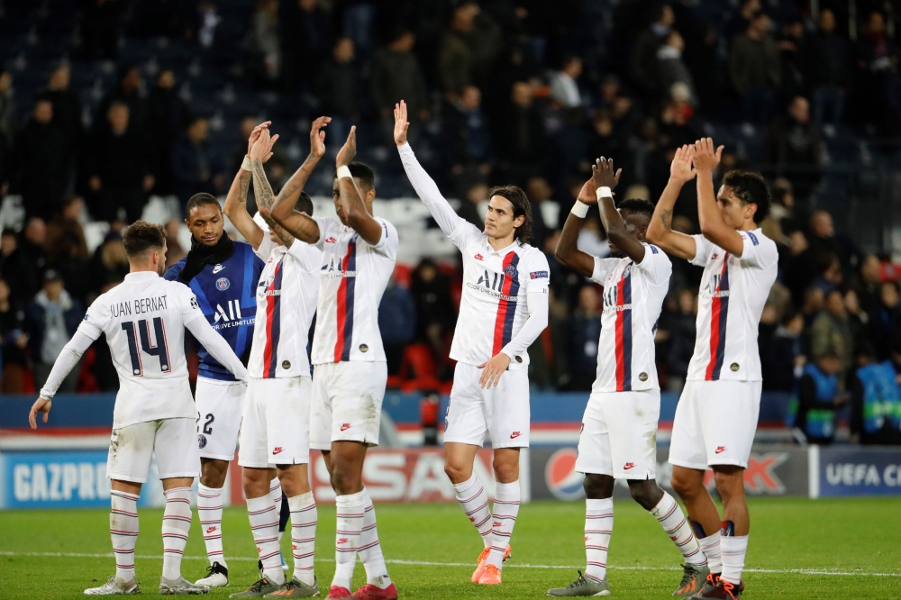 Paris Saint-Germain's players celebrate after winning the UEFA Champions League Group A football match between Paris Saint-Germain (PSG) and Club Brugge at the Parc des Princes stadium in Paris on November 6, 2019. / AFP / Thomas SAMSON