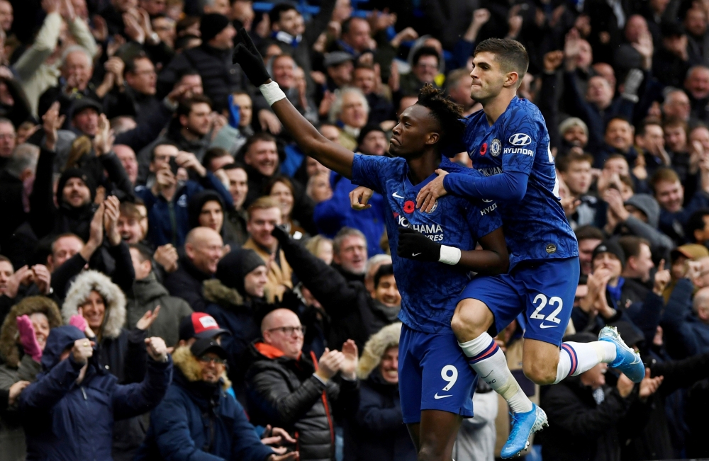 Chelsea's Tammy Abraham celebrates scoring their first goal with Christian Pulisic. Reuters/Tony O'Brien