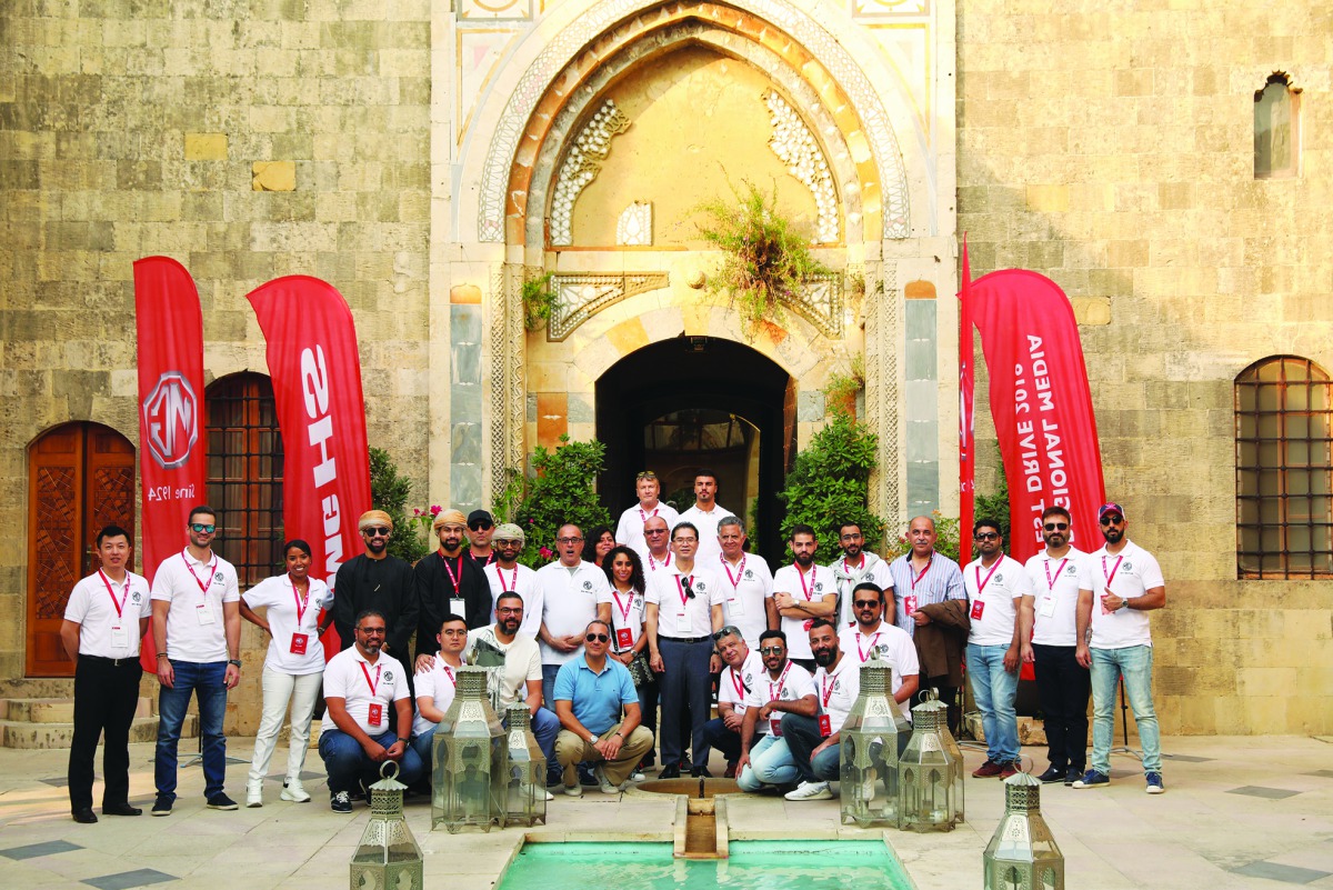 Visitors from Qatar posing for a group picture with other officials from Auto Class Cars, which hosted them in Lebanon.