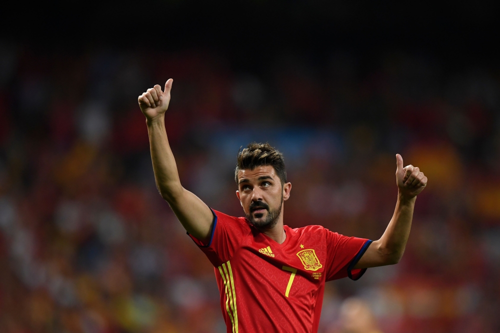 FILE PHOTO: Spain's forward David Villa waves as he celebrates their victory at the end of the World Cup 2018 qualifier football match Spain vs Italy at the Santiago Bernabeu stadium in Madrid.   AFP / GABRIEL BOUYS