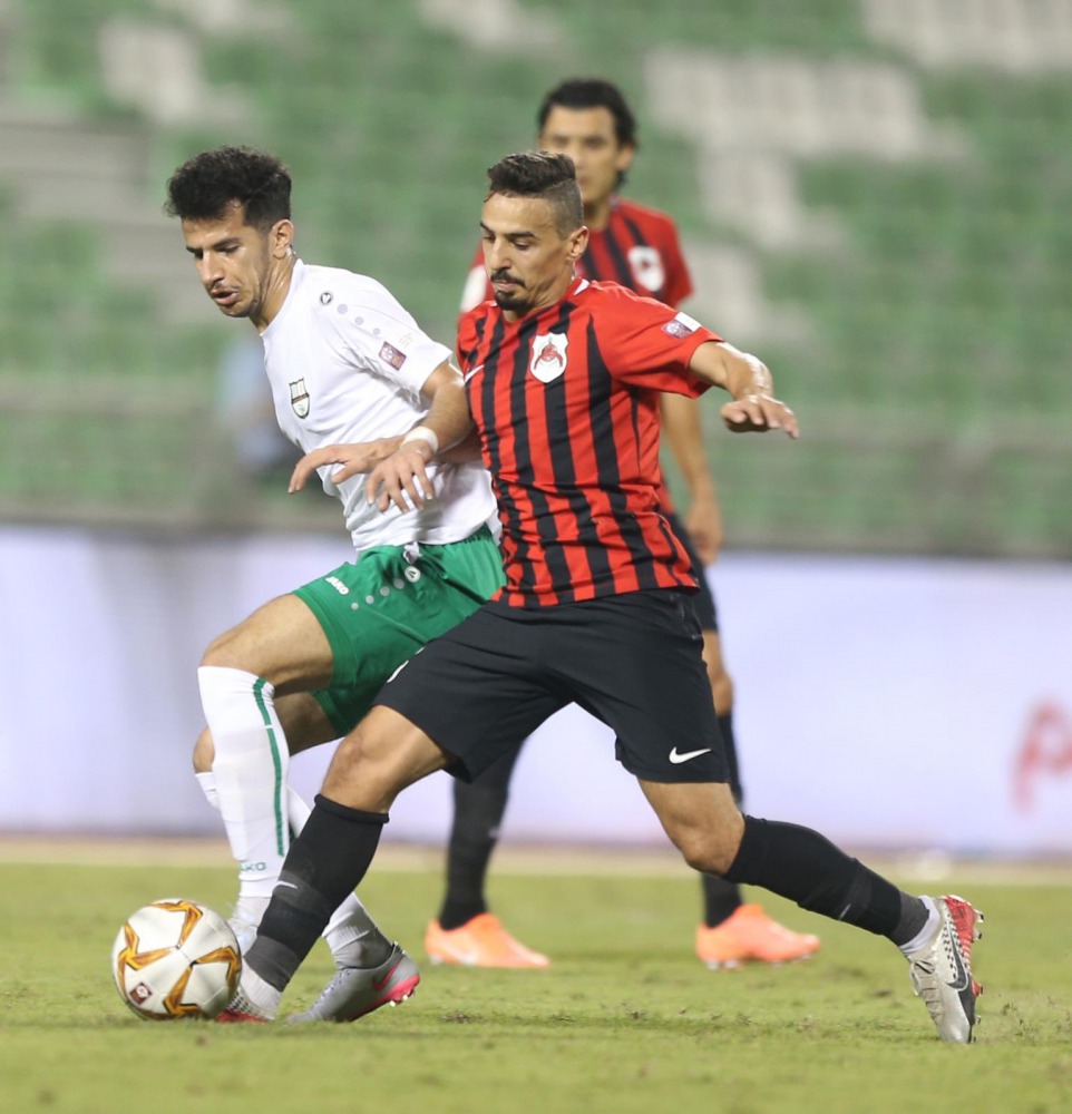 Al Rayyan and Al Ahli players vie for the ball possession during their Ooredoo Cup Round 2 match played at the Al Ahli Stadium, yesterday.