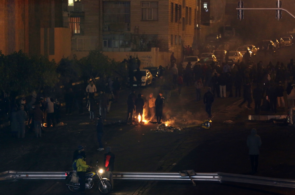  Demonstrators block main streets of Tehran during a demonstration against a government decision to hike petrol prices, in Tehran, Iran on November 16, 2019.  Fatemeh Bahrami - Anadolu 