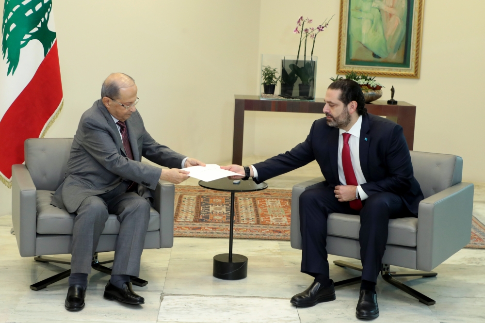 FILE PHOTO: PM Saad Hariri hands President Michel Aoun resignation at the Baabda presidential palace Beirut on October 29, 2019 bowing to nearly two weeks of unprecedented nationwide protests. AFP / Dalati And Nohra handout