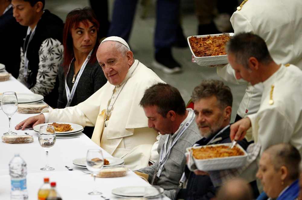 Pope Francis attends a lunch with the poor after celebrating a Mass marking the Roman Catholic Church's World Day of the Poor, in Paul VI Hall at the Vatican, November 17, 2019. Reuters/Guglielmo Mangiapane  