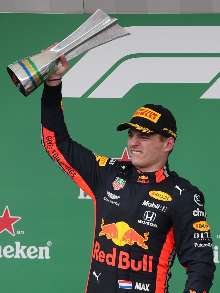 Brazilian Grand Prix race winner Red Bull’s Max Verstappen celebrates on the podium with the trophy at the Autodromo Jose Carlos Pace, Interlagos, Sao Paulo, Brazil. Reuters/Ricardo Moraes 
