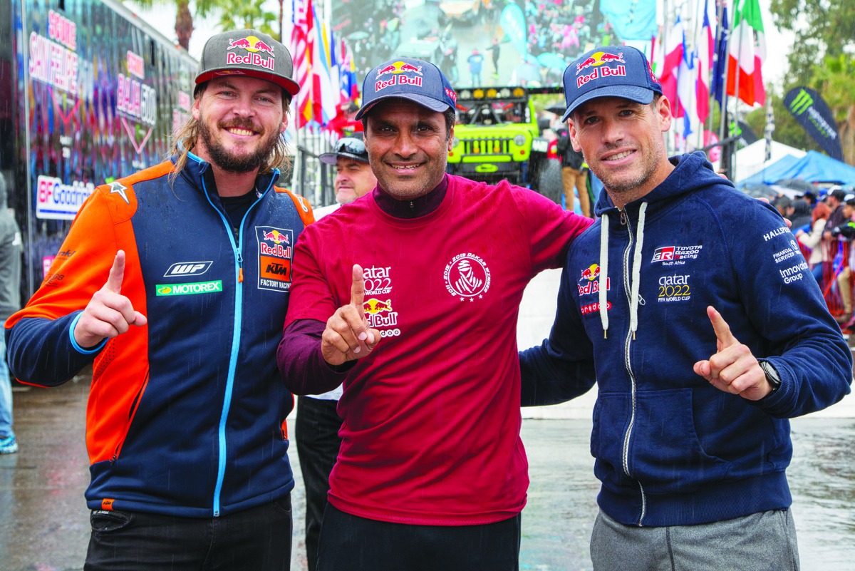 Qatar’s Nasser Al Attiyah (centre), Australian Toby Price (left) and Mathieu Baumel pose for a picture during the Baja 1000 in Mexico.