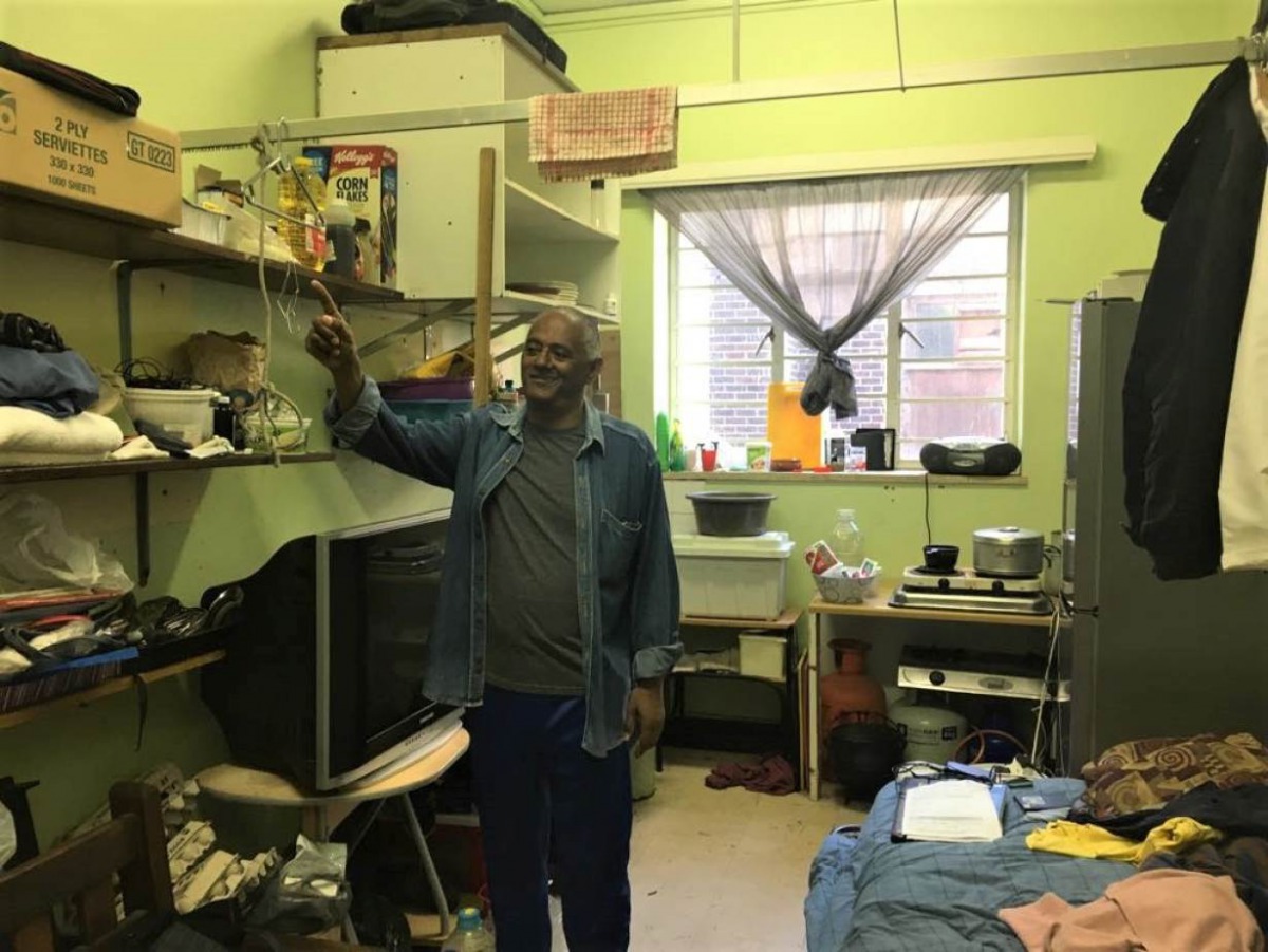 Bevil Lucas, housing activist, points to a shelf in his bedroom in the occupied Woodstock hospital in Cape Town, South Africa, 17 October 2019. Thomson Reuters Foundation/Kim Harrisberg