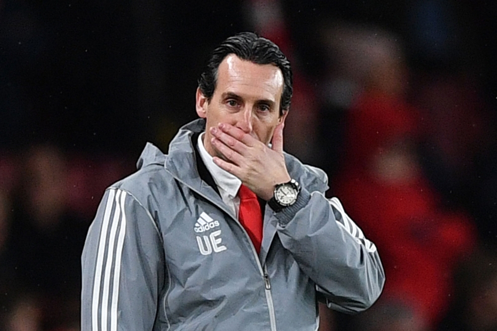 (FILES) In this file photo taken on November 28, 2019, Arsenal's Spanish head coach Unai Emery (L) reacts as Eintracht Frankfurt Adolf Hutter gestures at the UEFA Europa league Group F football match between Arsenal and Eintracht Frankfurt at the Emirates