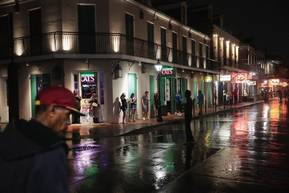 File photo: Visitors check out the attractions along Bourbon Street in the French Quarter despite rainfall from Hurricane Barry on July 12, 2019 in New Orleans. Scott Olson / Getty Images / AFP