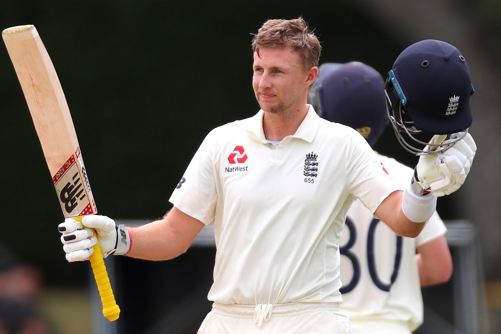 England's batsman Joe Root celebrates his double century (200 runs) on day four of the second cricket Test match between England and New Zealand at Seddon Park in Hamilton on December 2, 2019. / AFP / DAVID GRAY