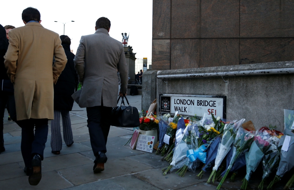 Commuters walk past the scene of a fatal attack on London Bridge in London, Britain December 2, 2019. REUTERS/Henry Nicholls
