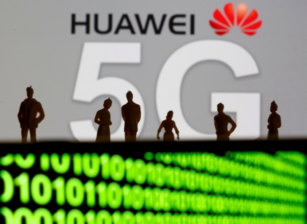 Small toy figures are seen in front of a displayed Huawei and 5G network logo in this illustration picture dated March 30, 2019. Reuters / Dado Ruvic
