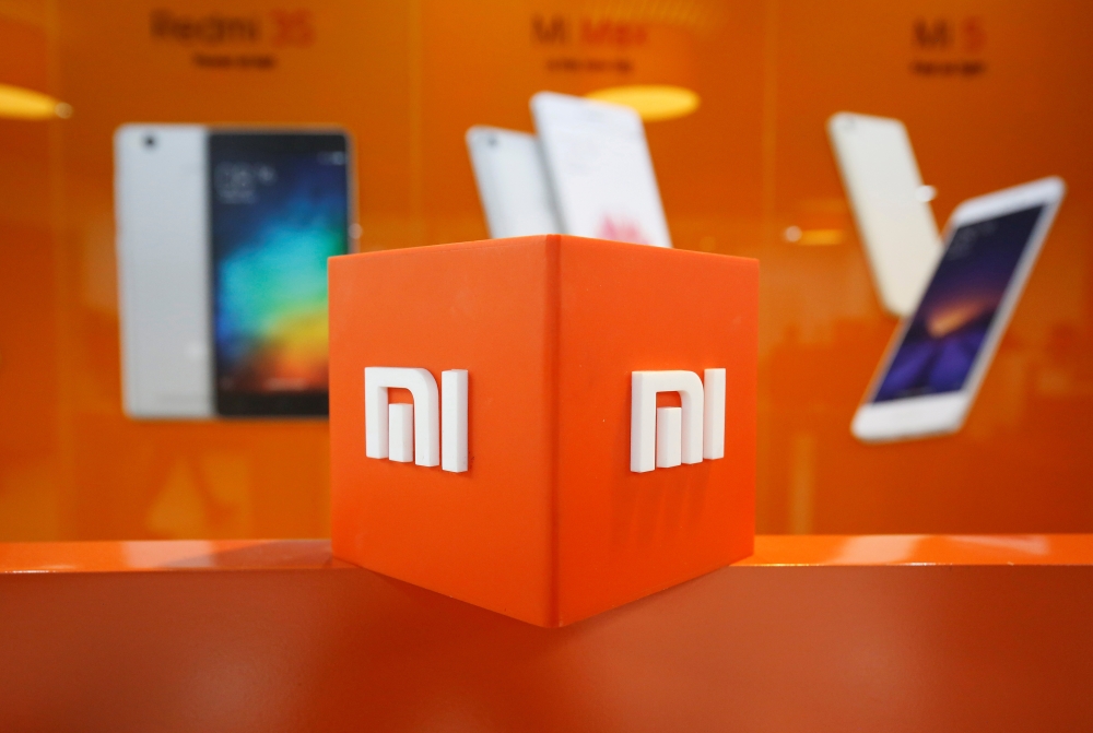 FILE PHOTO: The logo of Xiaomi is seen inside the company's office in Bengaluru, India, January 18, 2018. Reuters /Abhishek N. Chinnappa