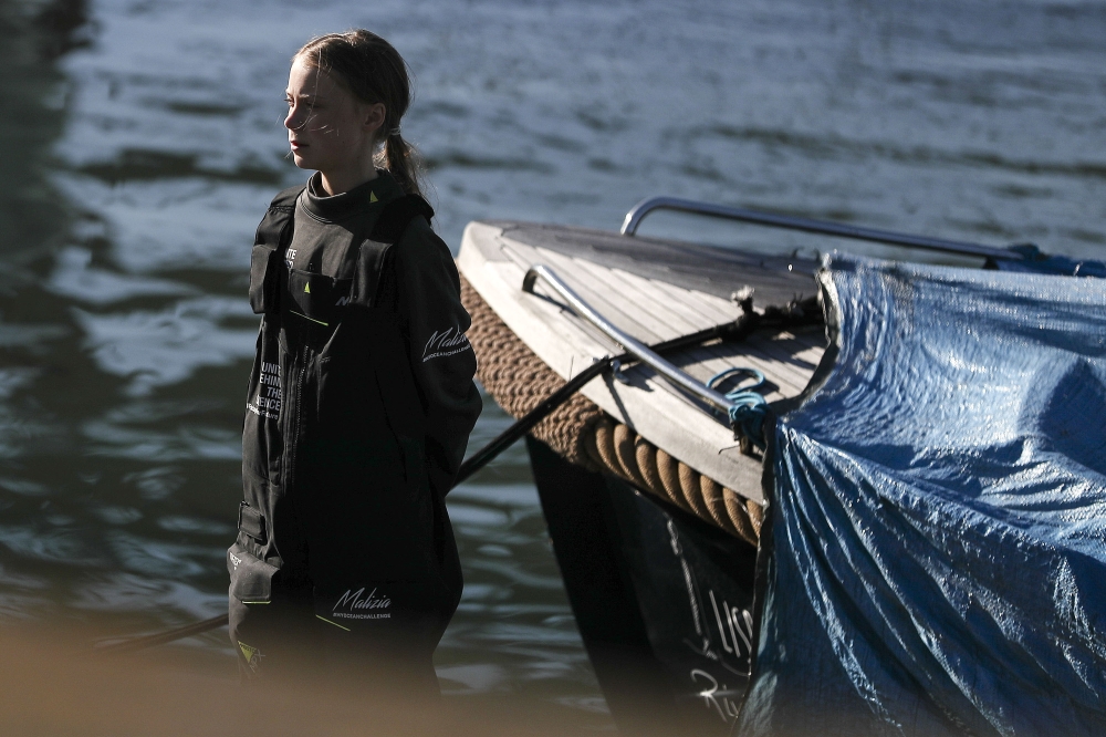 Swedish climate activist Greta Thunberg is pictured after disembarking from the catamaran La Vagabonde at the Santo Amaro docks in Lisbon, on December 3, 2019. AFP / Carlos Costa
