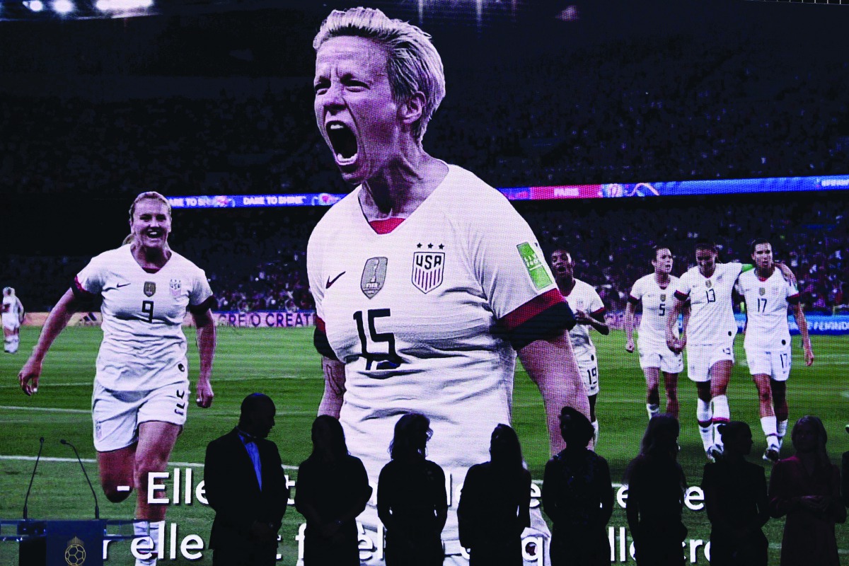 A video of Reign FC's US midfielder Megan Rapinoe is displayed after she won the Ballon d'Or France Football 2019 women's trophy at the Chatelet Theatre in Paris on December 2, 2019. AFP / Franck Fife
